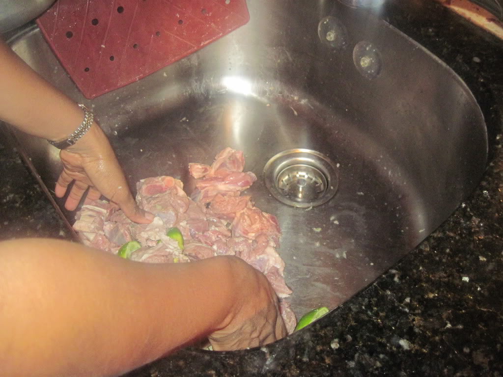 Lime wedges rubbed on meat. Clean meat with limes.